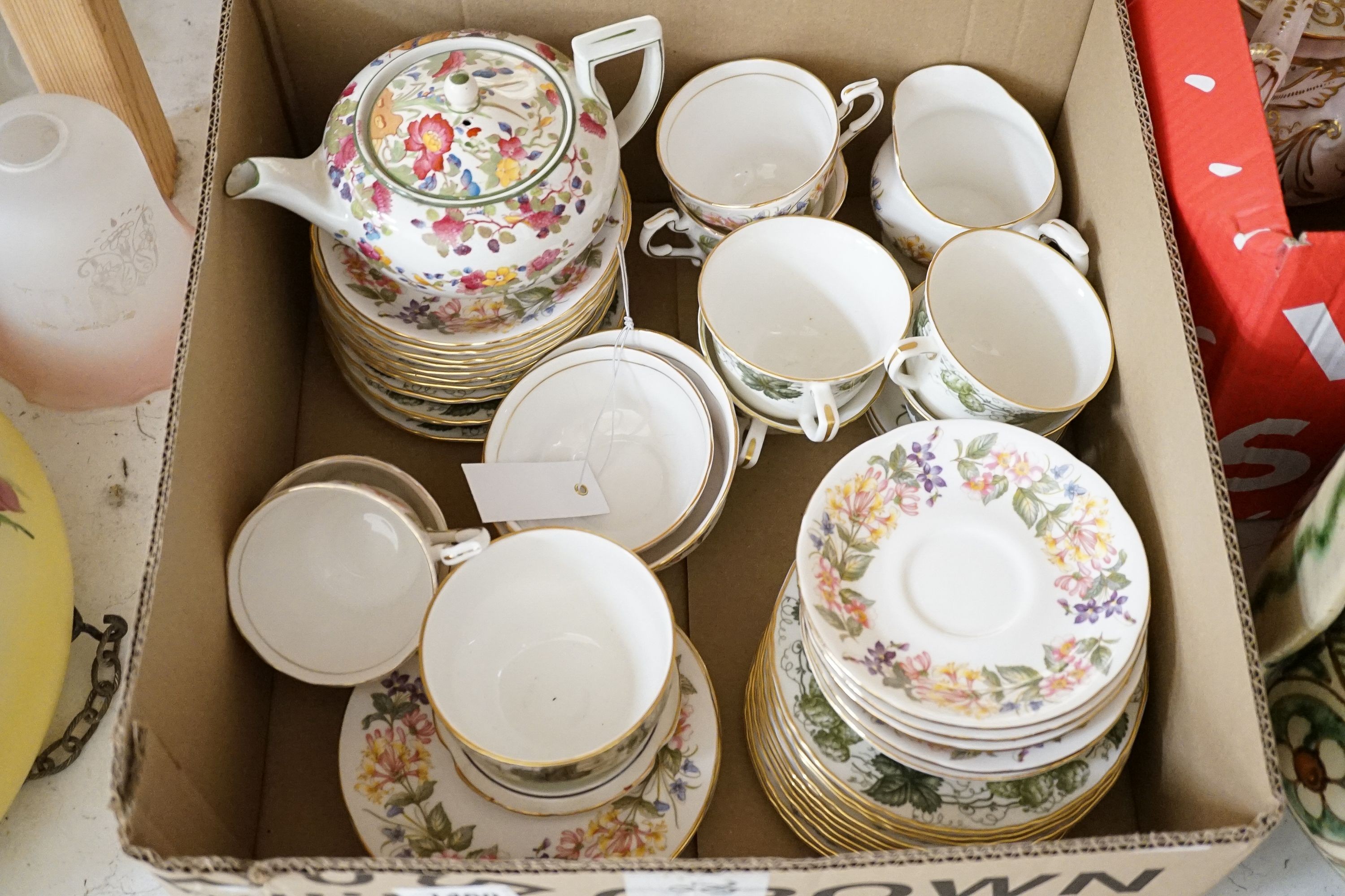 A Crown Staffordshire fifty nine piece part tea set and dessert service, central flowers and gilt borders, a Paragon part tea set and other ceramics